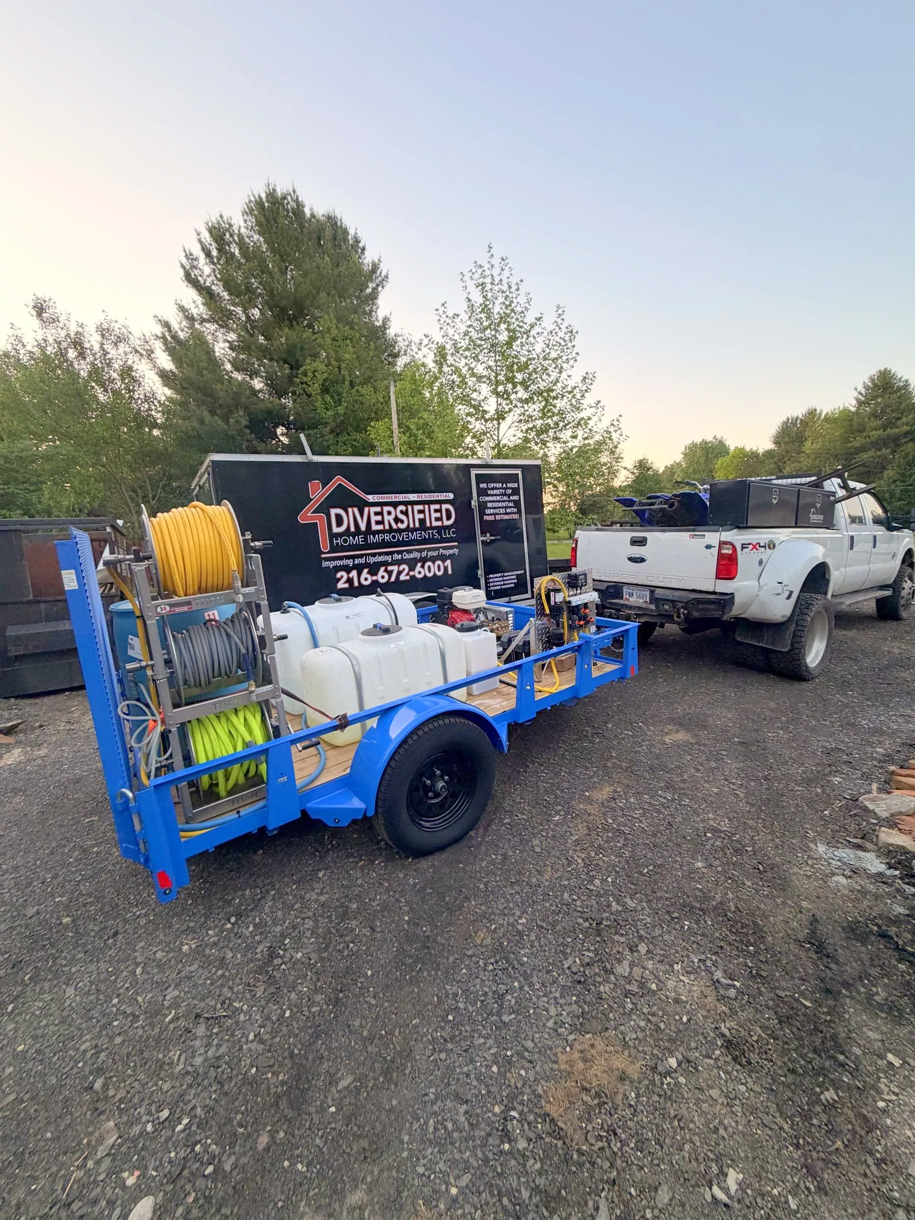 Soft wash rig on its trailer, with the DHI enclosed trailer and truck